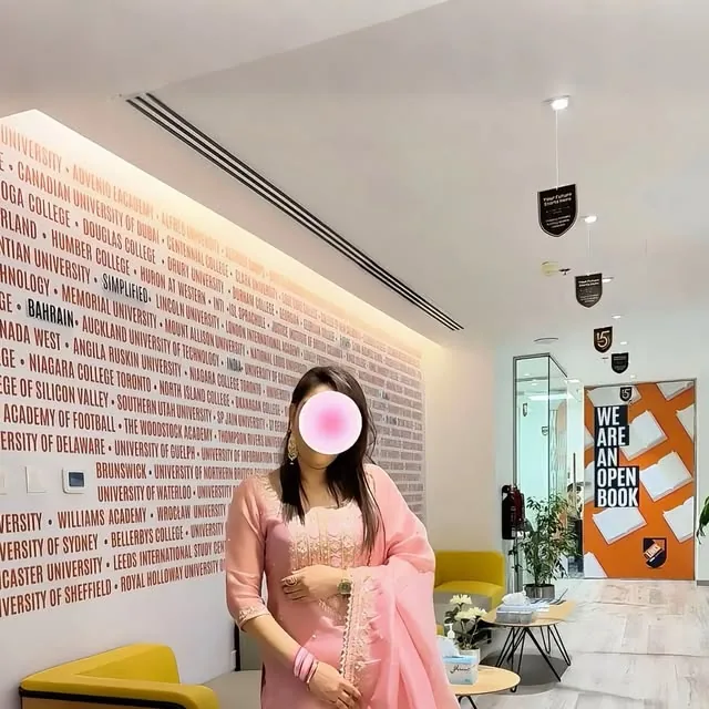 A customer in a pink Pakistani suit with gharara, custom stitched by Al Manaya Fashion